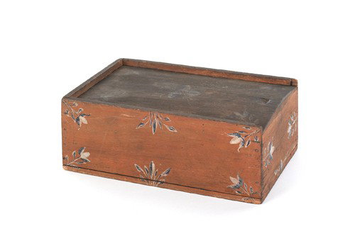 Painted pine slide lid box, 19th c., with blue: Painted pine slide lid box, 19th c., with blue and white floral decoration on a salmon ground, 4'' h., 10 3/4'' w., 7'' d.
