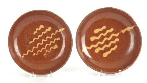 Two Berks County, Pennsylvania redware plates, a: Two Berks County, Pennsylvania redware plates, attributed to Willoughby Smith (Womelsdorf, Berks County, Pennsylvania, 1839-1905), 8'' dia.