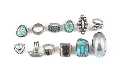 Twelve silver rings, some sterling, some with var: Twelve silver rings, some sterling, some with various stones including turquoise, abalone, banded agate cameo, includes a Mexican example, 2.33 ozt.