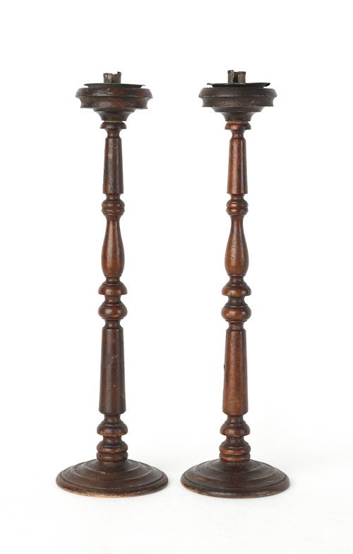 Pair of turned wooden candlesticks, 19th c., 23'': Pair of turned wooden candlesticks, 19th c., 23'' h., together with a tobacco jar, inscribed St. Domingo, 9 1/2'' h.