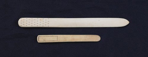 Two Northwest coast bone letter openers, 19th c.,: Two Northwest coast bone letter openers, 19th c., one with gold inlays, 6'' l. and 10 3/4'' l.