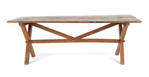 New England pine sawbuck table, 19th c., retain: New England pine sawbuck table, 19th c., retaining an old stained surface, 28 1/4'' h., 80'' w., 28'' d.