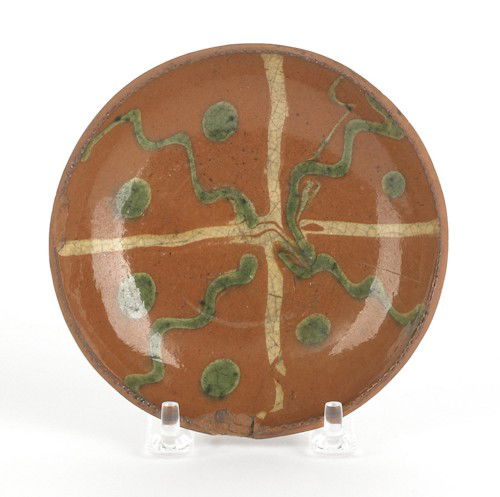 Miniature Pennsylvania redware pie plate, 19th c: Miniature Pennsylvania redware pie plate, 19th c., with green and yellow slip decoration, 4 7/8'' dia.