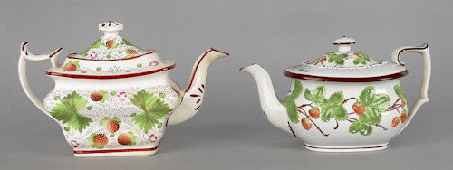 Two pearlware strawberry pattern teapots, 19th c: Two pearlware strawberry pattern teapots, 19th c., 6'' h. and 7'' h.