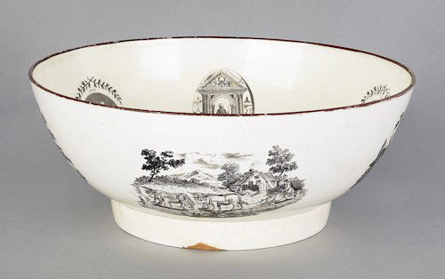 Large English creamware bowl, 19th c., the outs: Large English creamware bowl, 19th c., the outside with transfer decorated farm scenes, the interior with a central American ship surrounded by oval vignettes of Faith, Charity, and Hope, 5 1/4'' h.,