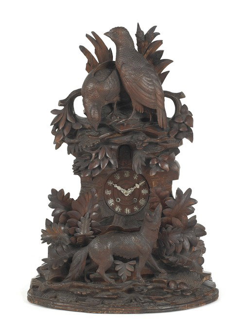 Ornate Black Forest cuckoo clock with fox chasi: Ornate Black Forest cuckoo clock with fox chasing fowl, 37'' h.