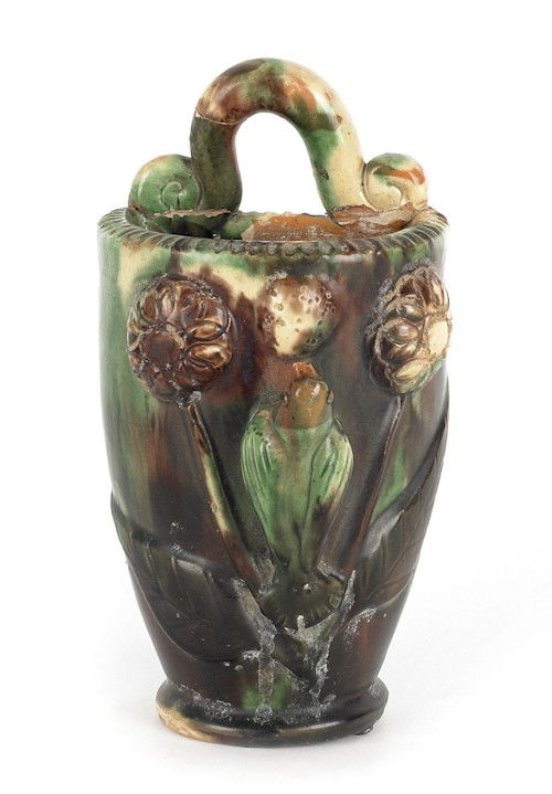 Shenandoah Valley redware wall pocket, late 19th: Shenandoah Valley redware wall pocket, late 19th c., with green, yellow, and orange slip decorated bird and flowers in relief decoration, 7 5/8'' h.