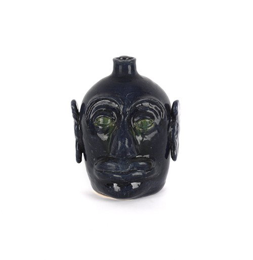Georgia stoneware face jug by Edwin Meaders, sign: Georgia stoneware face jug by Edwin Meaders, signed on base, 10 1/4'' h.