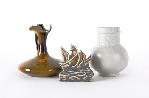 Rookwood pottery sailing ship paperweight, 4'' h.,: Rookwood pottery sailing ship paperweight, 4'' h., together with a ewer and vase signed in script Rookwood Pottery in 1881, 6'' h. and 5 1/2'' h.