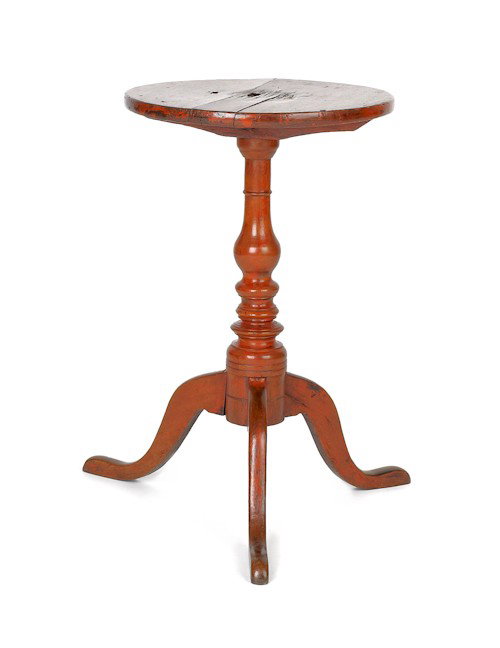 Pennsylvania Queen Anne candlestand, ca. 1800, wi: Pennsylvania Queen Anne candlestand, ca. 1800, with an old red painted surface, 25'' h., 16'' dia.