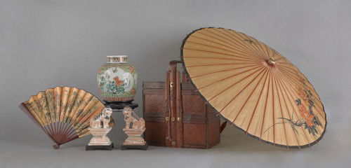 Chinese basket, early 20th c., together with a Ch: Chinese basket, early 20th c., together with a Chinese parasol, a painted fan, a pair of earthenware foo dogs, a ginger jar, and four metal sculptures.