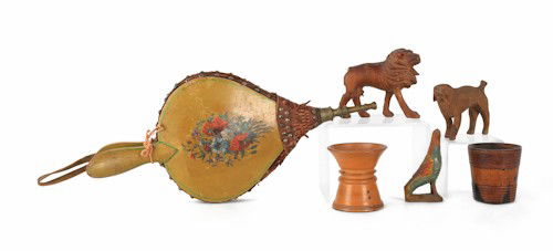 Three carved pine figures of a dog, a lion, and a: Three carved pine figures of a dog, a lion, and a bird, together with two sanders and painted bellows.
