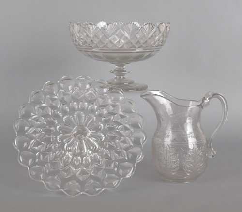 Bakewell, Pears & Co. Victoria glass cake stand,: Bakewell, Pears & Co. Victoria glass cake stand, 5'' h., 12 1/2'' dia., together with a cut glass footed bowl, 7 1/4'' h., 10 3/4'' dia., and a pressed leaf pattern pitcher, 8 1/2'' h.