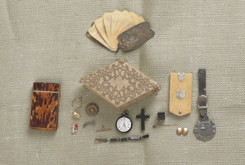 Miscellaneous dresser articles, 19th c., to inclu: Miscellaneous dresser articles, 19th c., to include tortoise shell card case, ivory tablet, sterling silver and celluloid day planner, watch fob, and a lady's pocket watch.