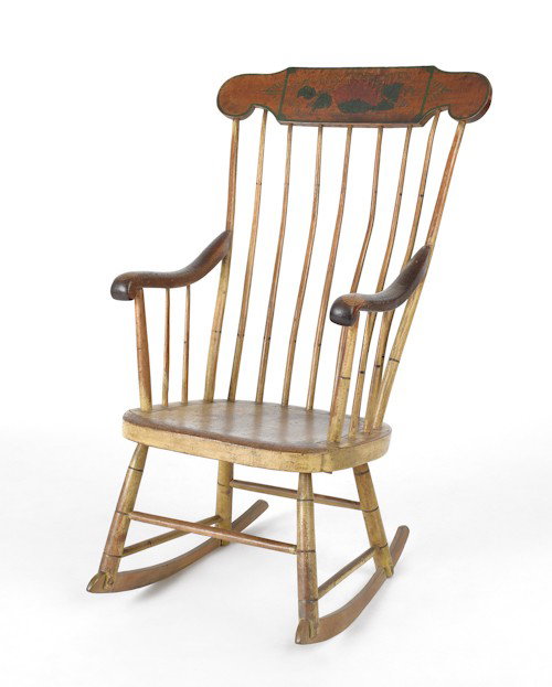 Decorated Windsor rocking chair, 19th c., with a: Decorated Windsor rocking chair, 19th c., with a floral decorated crest.