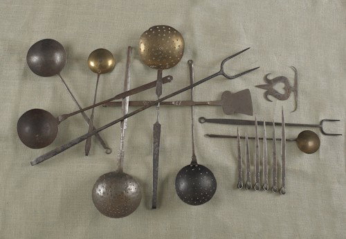 Six forged iron butcher's tools, 19th c., some wi: Six forged iron butcher's tools, 19th c., some with decorated handles together with six contemporary Tom Loose skewers and a tulip hanger.