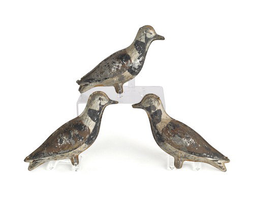Oversize painted tin quail, 20th c., 15 1/2'' h.,: Oversize painted tin quail, 20th c., 15 1/2'' h., 21'' l., together with three tin shore bird decoys.