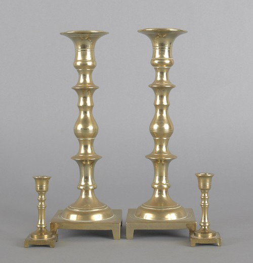 Group of lighting, to include two brass candlesti: Group of lighting, to include two brass candlesticks and three painted porcelain table lamps.