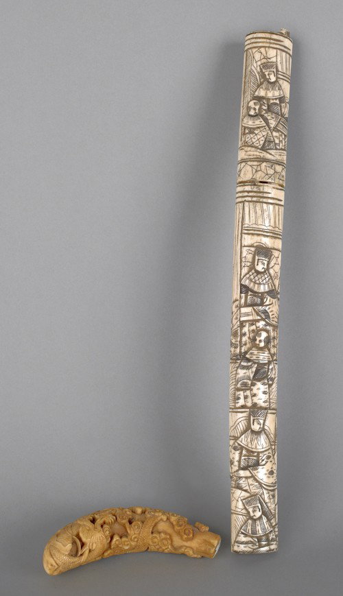Chinese carved ivory cane grip, 19th c., together: Chinese carved ivory cane grip, 19th c., together with a Japanese carved ivory sword sheath fragment, 4 3/4'' l., and 15'' l.