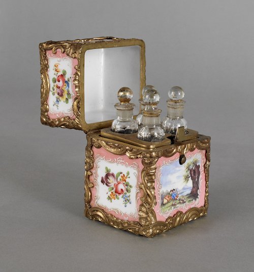 Continental enameled dresser box, 19th c., with: Continental enameled dresser box, 19th c., with a fitted interior having four faceted perfume bottles, the case with ormolu mounts, 3 1/2'' h., 2 1/4'' w.