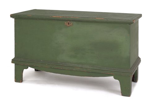New England painted pine blanket chest, ca. 1800: New England painted pine blanket chest, ca. 1800, with a lift lid and tall straight bracket feet, retaining its original green painted surface, 23 1/2'' h., 38'' w.