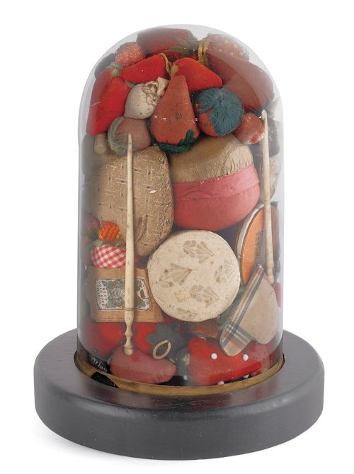 Glass dome sculpture containing various sewing a: Glass dome sculpture containing various sewing accoutrements, late 19th/early 20th c., to include pincushions in strawberry form, birch bark and quill needle case, thimbles, crochet hooks, etc.