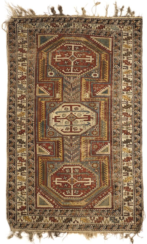 Caucasian throw rug with three medallions on a: Caucasian throw rug with three medallions on a red field with multiple borders, 5'4'' x 3'7''.