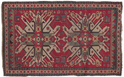 Eagle Kazak throw rug with a red field and mult: Eagle Kazak throw rug with a red field and multiple borders, 6'8'' x 4'1''.
