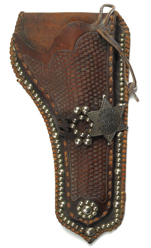 Leather tooled holster with a silver star, insc: Leather tooled holster with a silver star, inscribed Deputy Kern Co. 324 Sheriff, 11 1/2'' h.