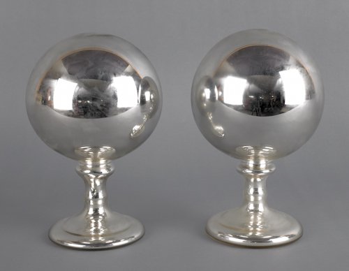 Pair of mercury glass witching balls, 9'' h.: Pair of mercury glass witching balls, 9'' h.