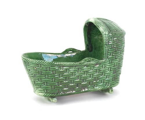 Creamware cradle, early 19th c., 3 1/2'' h., 5'' l: Creamware cradle, early 19th c., 3 1/2'' h., 5'' l.