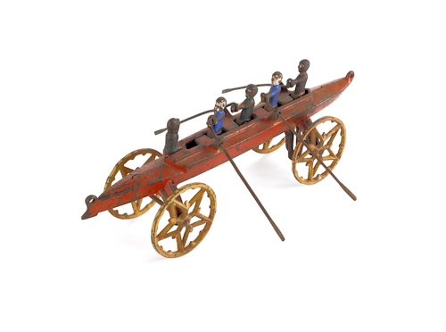 U.S. Hardware painted cast iron sculling team toy: U.S. Hardware painted cast iron sculling team toy, early 20th c., with four scullers and coxwain at the helm, 10'' l.