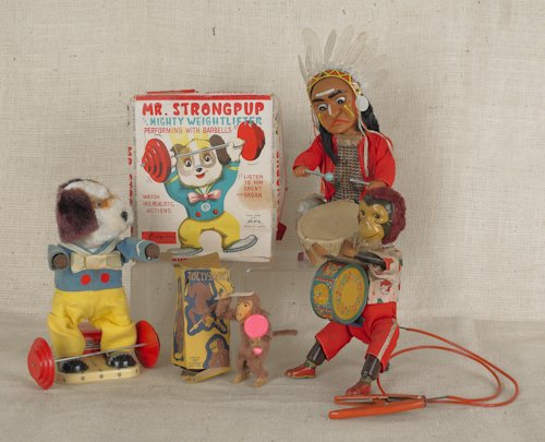 Two battery operated toys, 20th c., together with: Two battery operated toys, 20th c., together with a wind-up monkey and animated monkey drums, tallest - 12''.