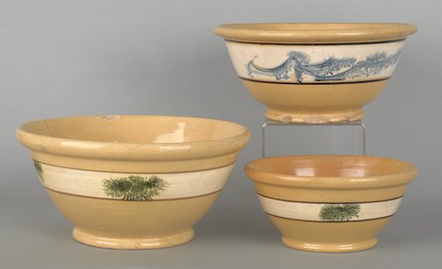 Three yelloware mochaware mixing bowls, 19th c.,: Three yelloware mochaware mixing bowls, 19th c., with seaweed decoration, largest - 12 3/4'' dia.