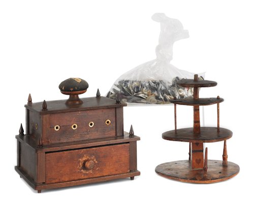 Mahogany sewing box together with a spool caddy a: Mahogany sewing box together with a spool caddy and a large group of miscellaneous buttons, tallest - 6 1/2''.