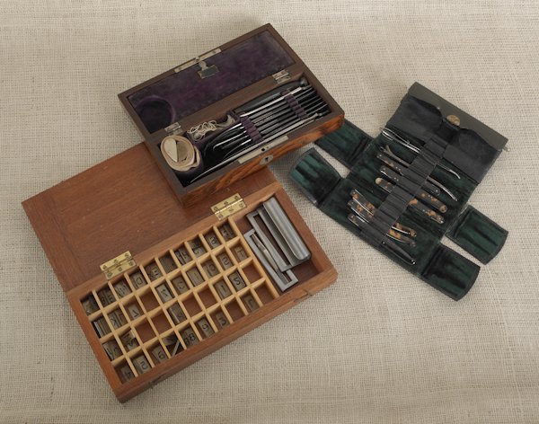 Surgeon's kit with rosewood case, together with X: Surgeon's kit with rosewood case, together with X-ray stenciling kit, case labeled Watson and Son, and dentist's tool set.