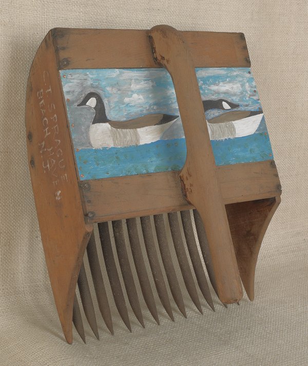 Painted and carved Canada goose wall plaque, sign: Painted and carved Canada goose wall plaque, signed Charlie Bryan and dated 1960, 24'' l., together with a painted cranberry rake.