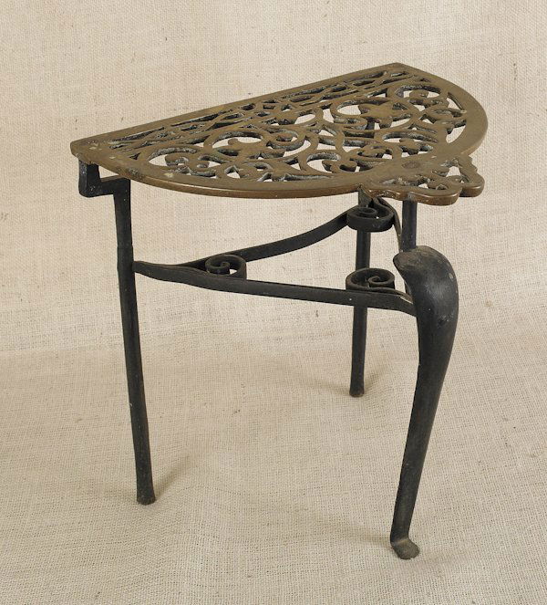 English brass and iron trivet, 19th c., 14 1/2'' h: English brass and iron trivet, 19th c., 14 1/2'' h., 15 1/2'' w.