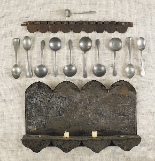 Tin spoon rack, together with a wall sconce and a: Tin spoon rack, together with a wall sconce and a collection of pewter spoons.