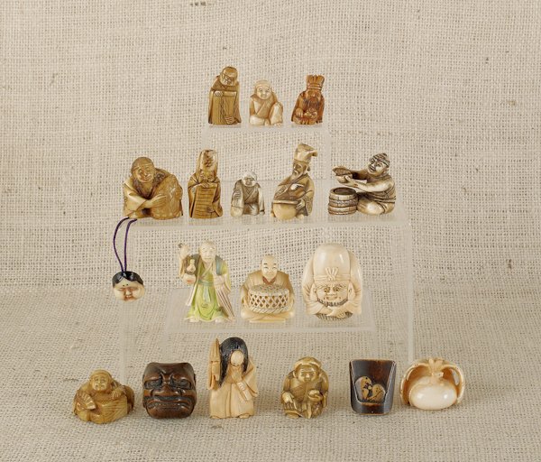 Eighteen Japanese carved ivory and boxwood netsuk: Eighteen Japanese carved ivory and boxwood netsukes.