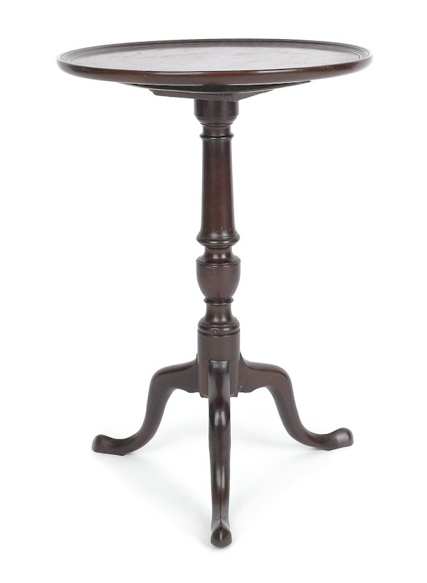 George II mahogany candlestand, ca. 1765, with: George II mahogany candlestand, ca. 1765, with a tilt top and an urn standard, 27'' h., 18 3/4'' w.