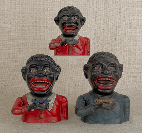 Two jolly black men cast iron mechanical banks,: Two jolly black men cast iron mechanical banks, together with a Little Joe mechanical bank.