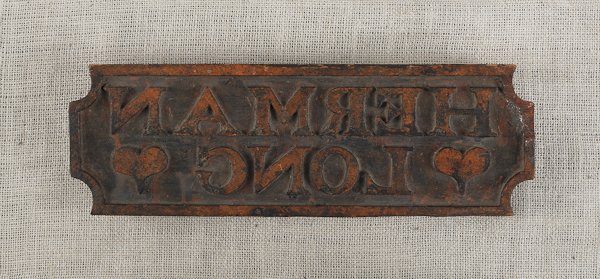 Pennsylvania carved and painted bag stamp, 19th: Pennsylvania carved and painted bag stamp, 19th c., for Herman Long, 5 1/4'' x 16''. Provenance: Richard Flanders Smith.