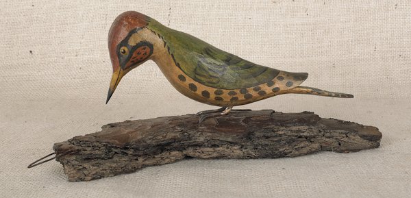 Carved and painted woodpecker, late 19th c., at: Carved and painted woodpecker, late 19th c., attributed to George Miller, Upper Black Eddy, Bucks County, Pennsylvania, 5'' h., 11 1/2'' w.
