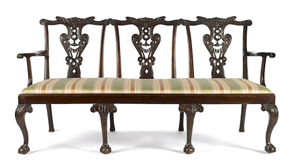 George III style carved mahogany settee.: George III style carved mahogany settee.