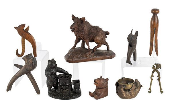 Collection of German carved Black Forest animals,: Collection of German carved Black Forest animals, to include a bear inkwell, a wild boar, and a squirrel nut cracker, together with a large wooden clothespin and a brass rooster nut cracker, tallest -