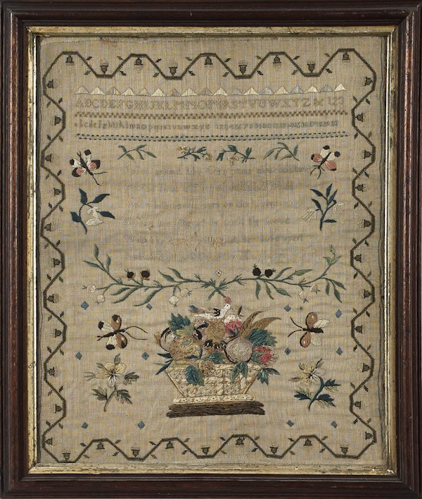 Needlework sampler, early 19th c., with a fruit b: Needlework sampler, early 19th c., with a fruit basket and a bird, 16 1/2'' x 13 1/2''.