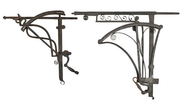 Two wrought iron fireplace cranes, ca. 1800, one: Two wrought iron fireplace cranes, ca. 1800, one illegibly signed, 40'' h. and 28'' h.