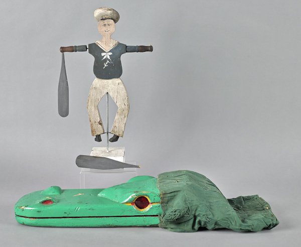 Painted alligator hand puppet, 18'' l., together w: Painted alligator hand puppet, 18'' l., together with a sailor whirligig, 15 1/2'' h.