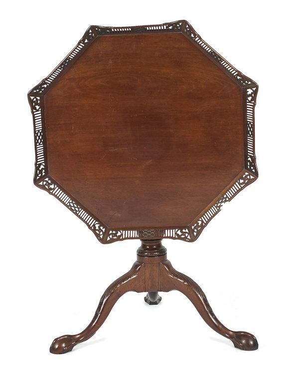 George II carved mahogany tea table, ca. 1770,: George II carved mahogany tea table, ca. 1770, with a pierced gallery tilting top and ball and claw feet, 29'' h., 29'' w.